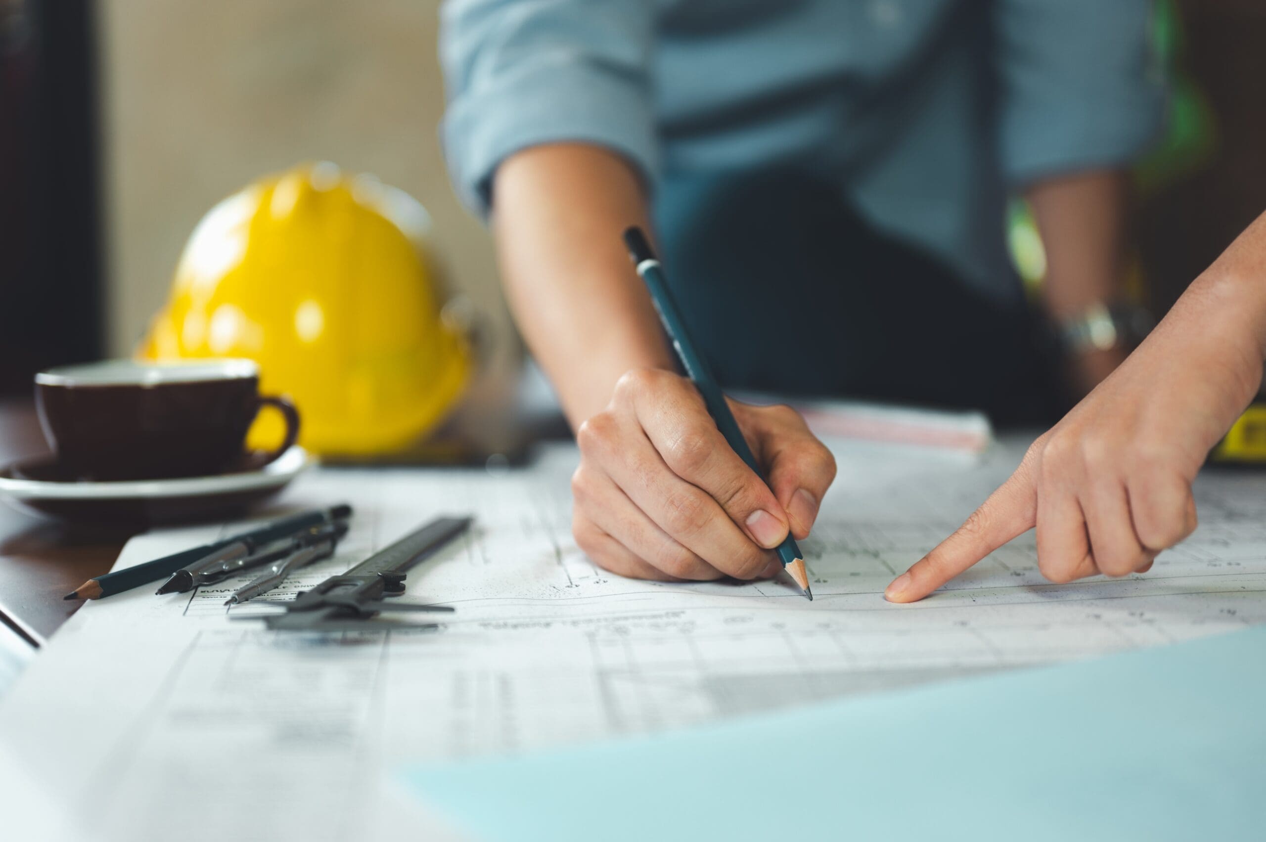 A builder and architect working together on plans.