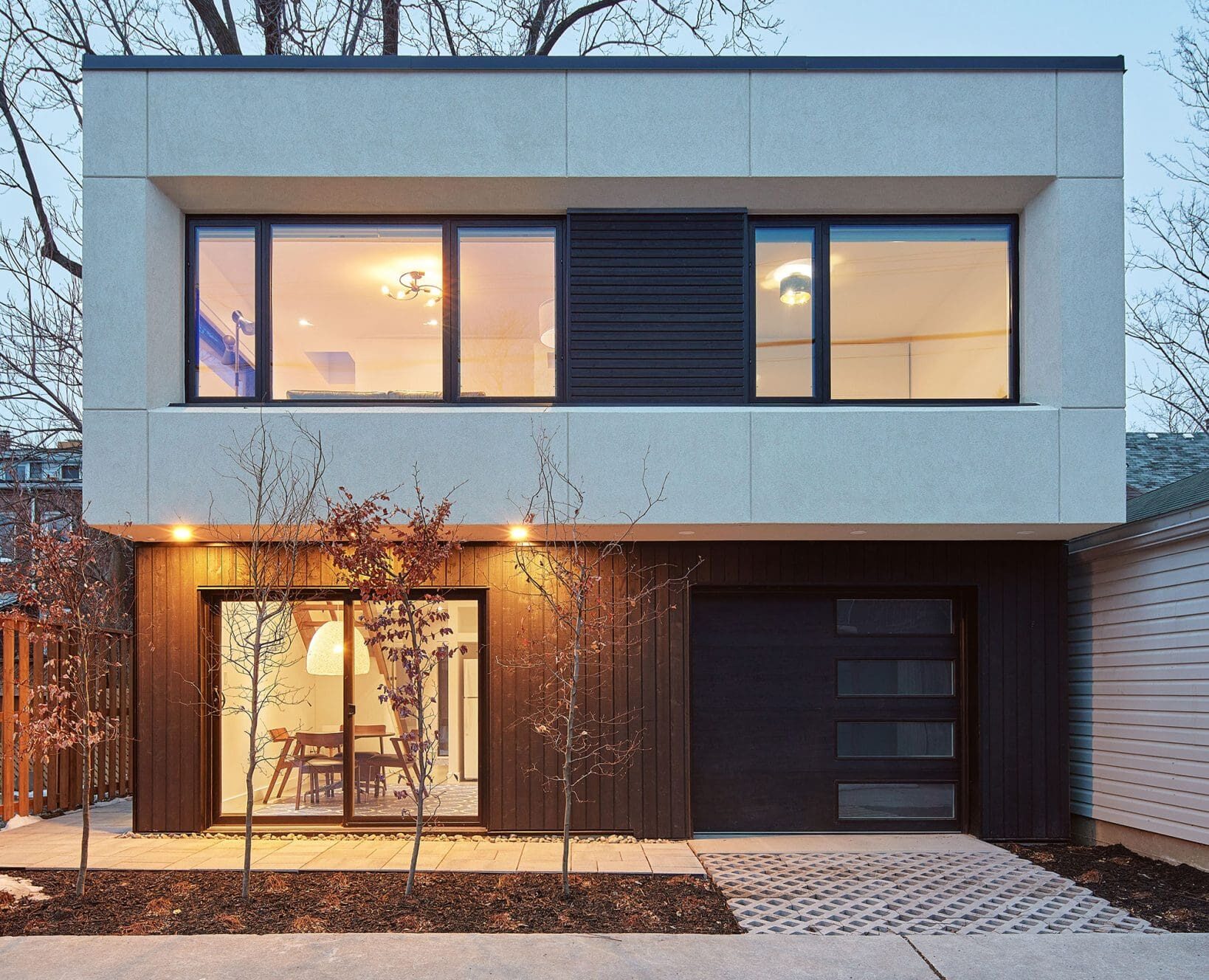 Exterior view of laneway or garden suite with big windows.